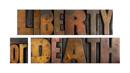 The words LIBERTY OR DEATH written in vintage letterpress typeの写真素材