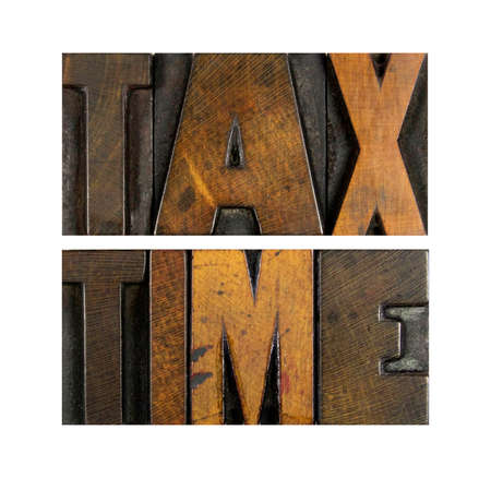 The words TAX TIME written in vintage letterpress typeの写真素材