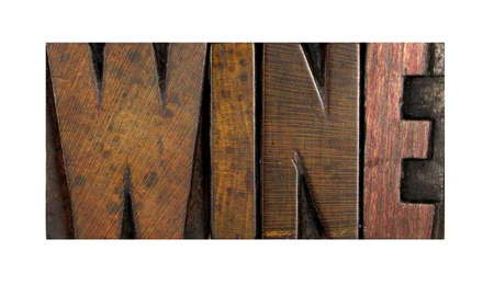 The word WINE written in vintage letterpress typeの写真素材