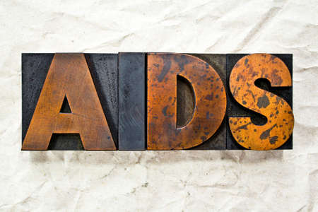 The acronym AIDS written in vintage letterpress wood typeの写真素材