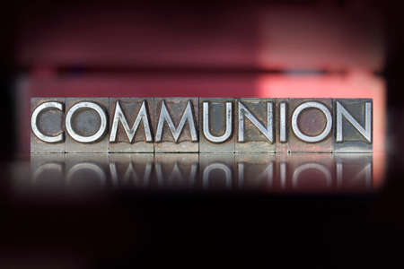 The word Communion written in vintage letterpress type