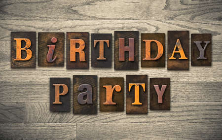 The words "BIRTHDAY PARTY" written in vintage wooden letterpress type.の写真素材