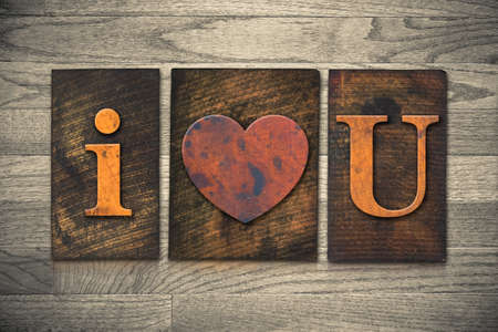 The words I HEART YOU written in vintage wooden letterpress type