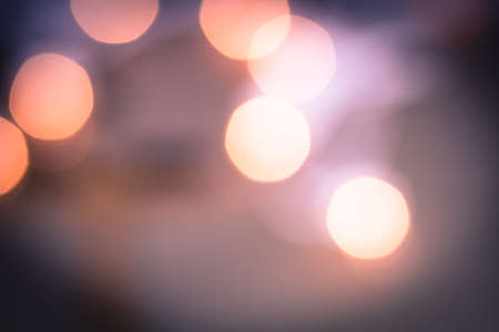 Purple, pink, and peach warm bokeh abstract lights.の写真素材