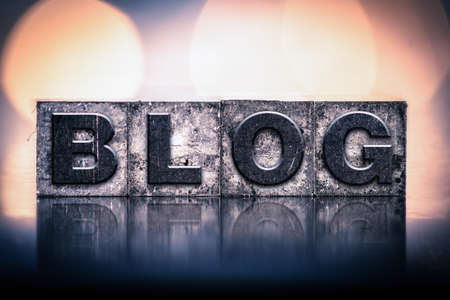 The word "BLOG" written in vintage ink stained letterpress type.の写真素材