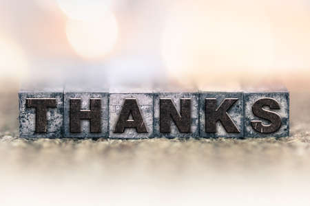 The word "THANKS" written in vintage ink stained letterpress type.の写真素材