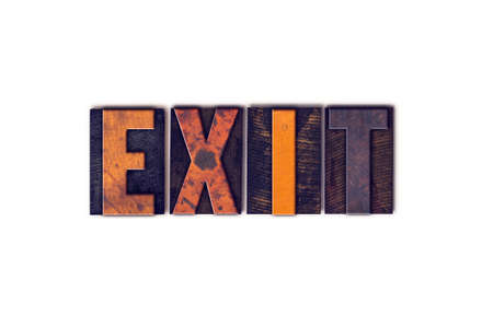 The word "Exit" written in isolated vintage wooden letterpress type on a white background.の写真素材