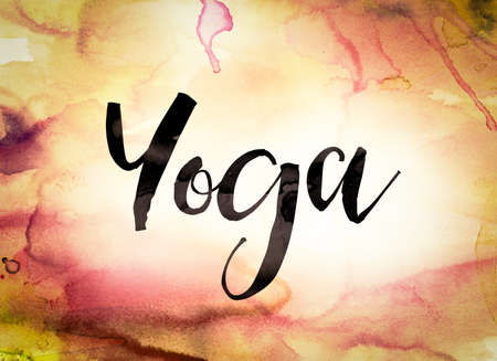 The word "Yoga" written in black paint on a colorful watercolor washed background.の写真素材