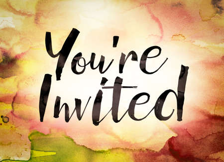 The word "You're Invited" written in black paint on a colorful watercolor washed background.の写真素材