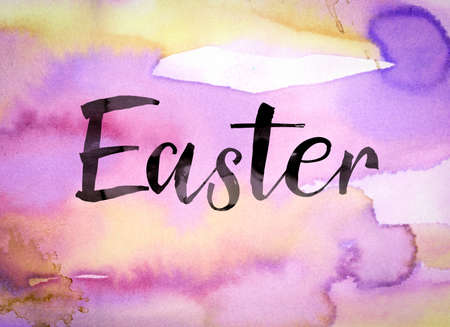 The word "Easter" written in black paint on a colorful watercolor washed background.の写真素材
