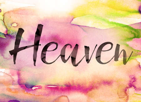 The word "Heaven" written in black paint on a colorful watercolor washed background.の写真素材