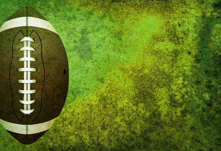 A green textured American football field background with ball. Room for copy.の写真素材