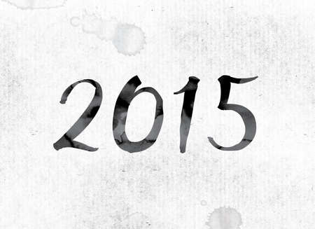 The word 2015 concept and theme painted in watercolor ink on a white paper.