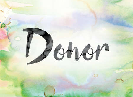 The word "Donor" painted in black ink over a colorful watercolor washed background concept and theme.の写真素材