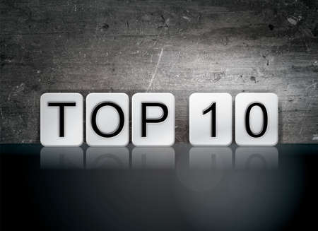 The word "Top 10" written in white tiles against a dark vintage grunge background.の写真素材