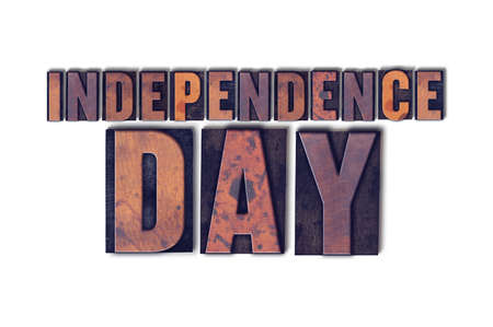 The words Independence Day concept and theme written in vintage wooden letterpress type on a white background.の写真素材