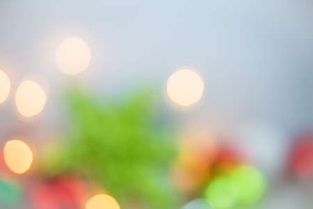 A Christmas holiday bokeh of lights and ornaments background.