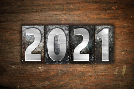 The year 2021 written in old vintage letterpress type.の写真素材