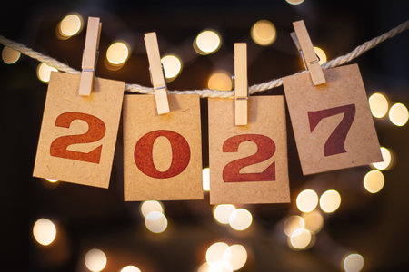 The year 2027 written on pinned cards hanging from a string.の写真素材