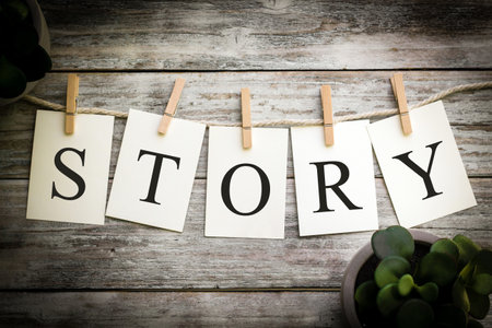 A set of printed cards spelling the word STORY on an aged wooden background.の写真素材