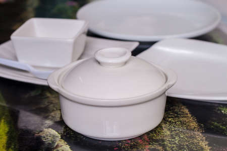 white ceramics plate and bowl on tableの写真素材