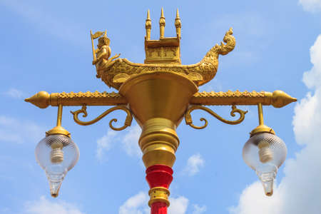 Thai art and Thai style street lamp against blue skyの写真素材