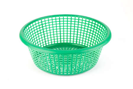 green color plastic basket on white backgroundの写真素材