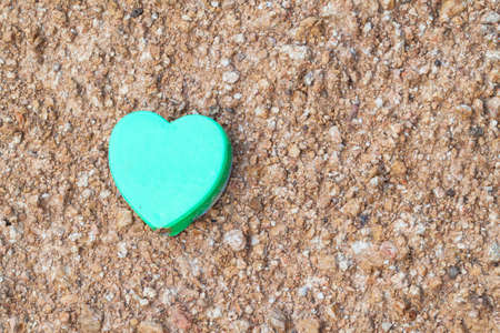 green box with heart shape placed on the ground.の写真素材