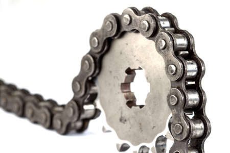 Roller chains with sprockets for motorcycles on white background