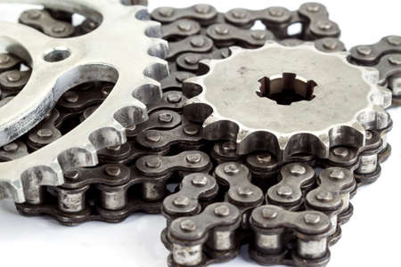 Roller chains with sprockets for motorcycles on white background