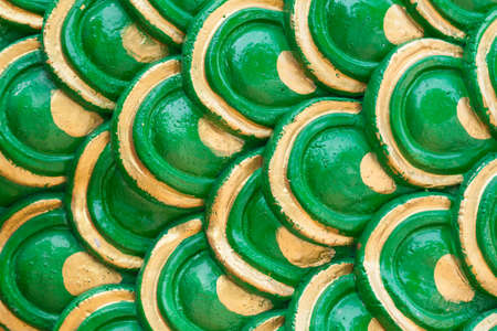 colorful of golden dragon scale for backgroundの写真素材