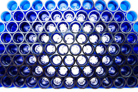 Light rays shining through blue plastic pipesの写真素材