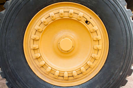 side view of yellow color truck wheel, industrial truck