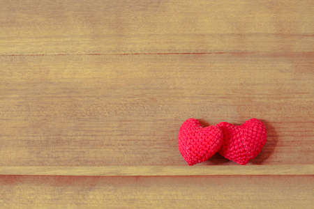 Heart shaped fabric on the wood shelfの写真素材