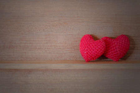 Heart shaped fabric on the wood shelfの写真素材