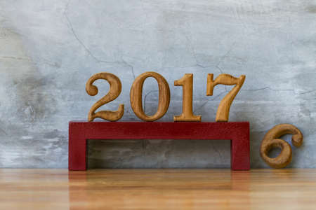 Number 2017 made from wood  on cement wall. new year celebrationsの写真素材