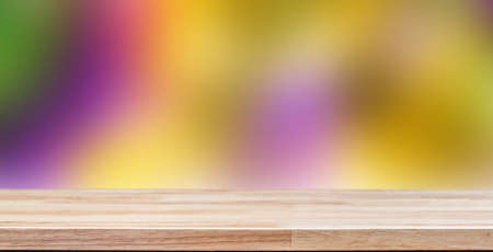 colorful background with empty wooden deck table for product montage display