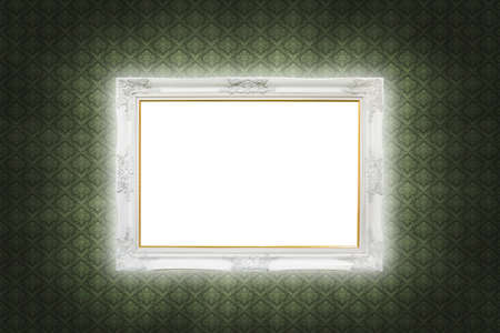 white photo frame isolated on vintage wallの写真素材