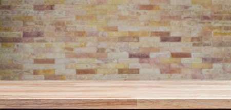 Empty wooden table on modern stone wall, for product display montageの写真素材