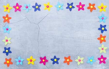 frame of paper flower on cement wall backgroundの写真素材