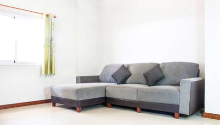 grey fabric sofa furniture in white roomの写真素材