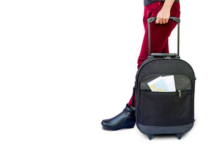 woman legs with a suitcase isolated on white backgroundの写真素材