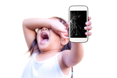 child with holding broken touch screen mobile phoneの写真素材