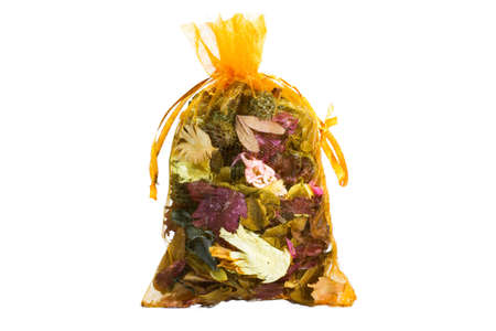 Mesh bag with dry aroma leaf on white backgroundの写真素材