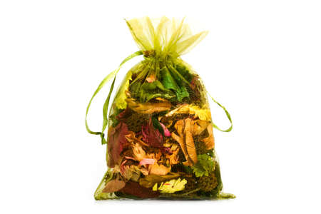 Mesh bag with dry aroma leaf on white backgroundの写真素材