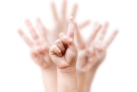 shows the number one on blurred child hand background . leader concept