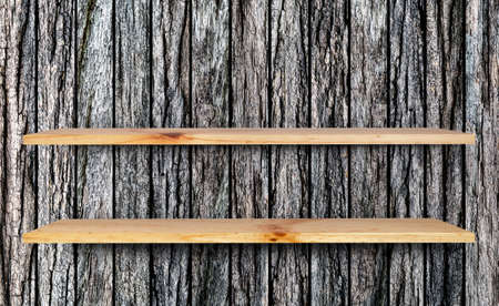 empty wooden shelf on old woodl backgroundの写真素材