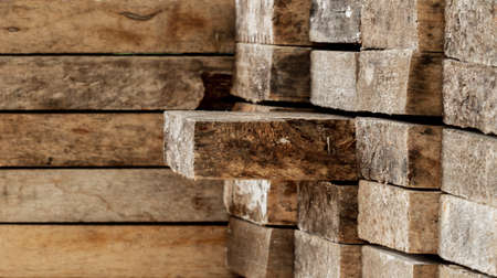 Stack of old wood planks, lumber backgroundの写真素材
