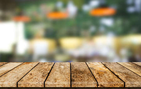 Wood shelf on blurred coffee shop background for product display montageの写真素材