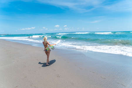 Beautiful sexy blonde surf girl at beachの写真素材